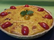Una foto de merluza tomates cherry