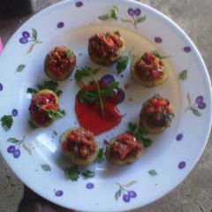 A picture of Sausage stuffed potatoes.
