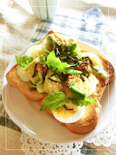 A picture of Boiled Egg and Avocado Toast with Wasabi, Shiso, and Salted Kelp.