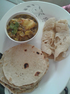 A picture of Chapati, crepes and potatoes curry.
