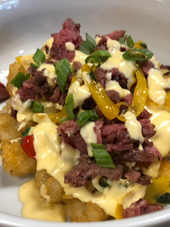 A picture of Cheesesteak Totchos.