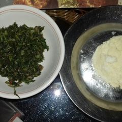 A picture of Ugali with fried amaranth(terere).