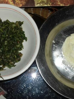 A picture of Ugali with fried amaranth(terere).
