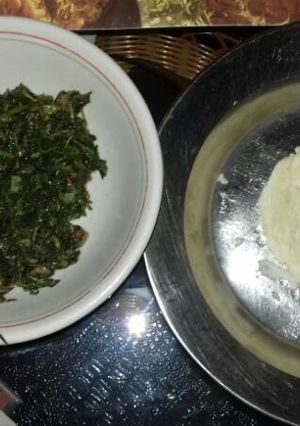 A picture of Ugali with fried amaranth(terere).