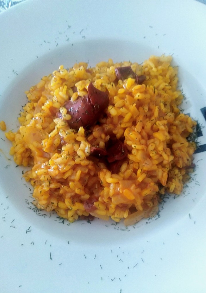 Una foto de Risotto con calamares en salsa americana