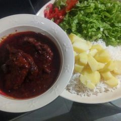 White rice,potatoes, stew and salad A picture of White rice,potatoes, stew and salad.