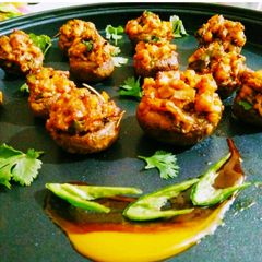 A picture of Saucy shrimp stuffed mushrooms.