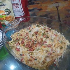 A picture of Baked vegetable spaghetti with white sauce.