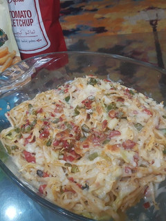 A picture of Baked vegetable spaghetti with white sauce.