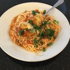 A picture of Meatball Parmesan on Angel Hair Pasta.