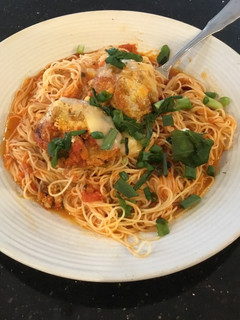 A picture of Meatball Parmesan on Angel Hair Pasta.