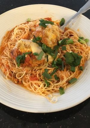 A picture of Meatball Parmesan on Angel Hair Pasta.
