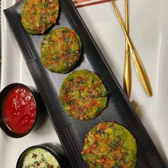 A picture of Palak Paneer mini Uttapa.