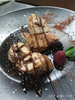 Una foto de Rulos de torrija con relleno de Gianduja
