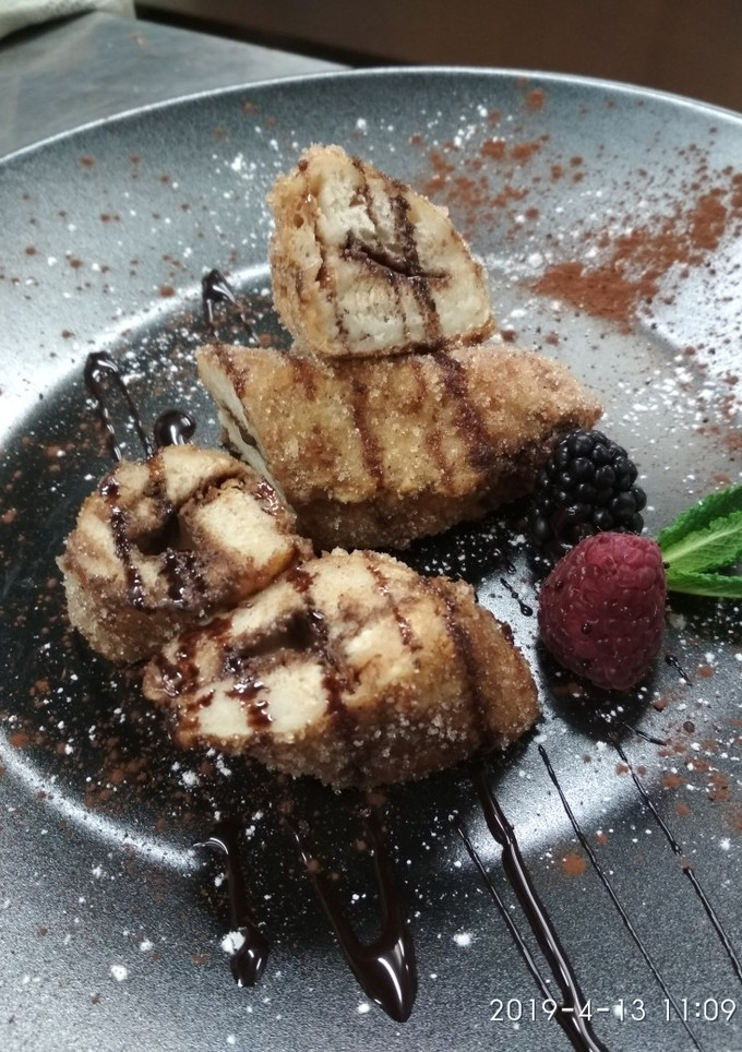 Una foto de Rulos de torrija con relleno de Gianduja