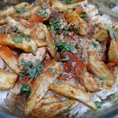 A picture of Unique Chicken rice with masala french fries 🍟.