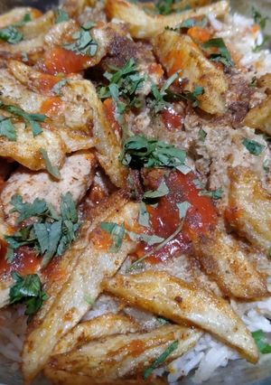 A picture of Unique Chicken rice with masala french fries 🍟.
