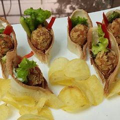 A picture of Crispy potato bread snacks with chips coating.