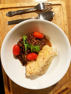 A picture of Rice Mayai served with lentils.