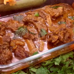 A picture of Chops with tomato gravy.