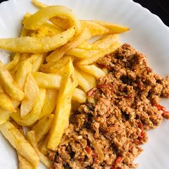 A picture of Chips with egg sauce.