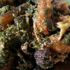 A picture of Afang Soup Meshed With Assorted Meats And Sea Foods.