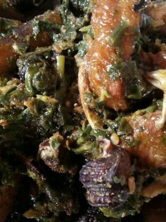 A picture of Afang Soup Meshed With Assorted Meats And Sea Foods.