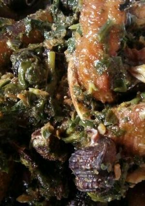A picture of Afang Soup Meshed With Assorted Meats And Sea Foods.