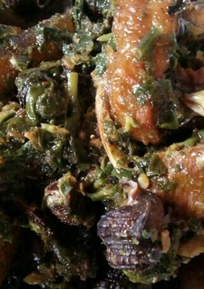 A picture of Afang Soup Meshed With Assorted Meats And Sea Foods.
