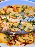 Lubinas de ración al horno con patatas panadera
