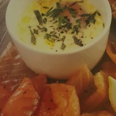 A picture of Slow cooker eggs en cocotte with smoked salmon.
