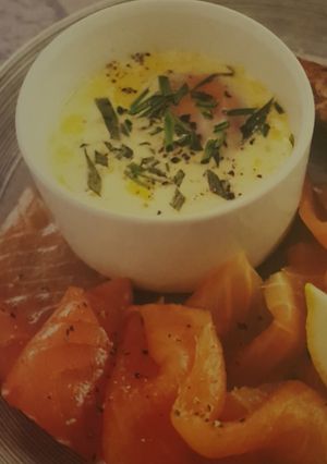 A picture of Slow cooker eggs en cocotte with smoked salmon.