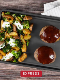 A picture of HC- Sheet Pan Cheddar-Jack BBQ Meatloaf with roasted loaded potatoes and broccoli.