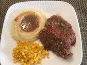 A picture of meatloaf and gravy