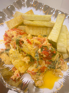 A picture of Egg sauce and fried yam.