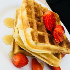 Waffles with honey and fruits A picture of Waffles with honey and fruits.