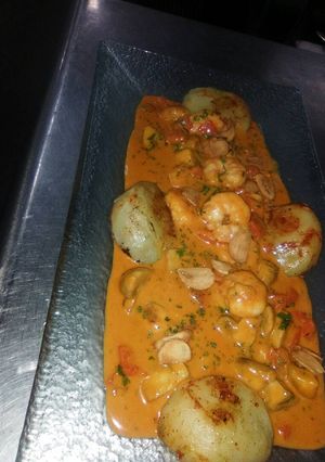 Una foto de Langostinos al ajillo estilo peruano