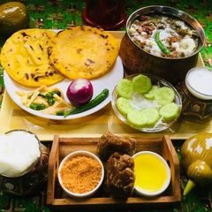 A picture of Sarso Ka saag with makki ki Roti.