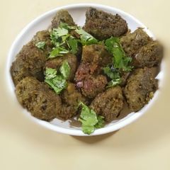 A picture of Bajri methi muthia/ pearlmilet fenugreek muthia.