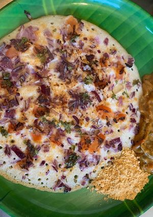 A picture of Pizza style Onion and Tomato Uthappam.