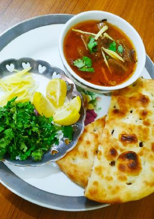 A picture of Beef nihari with kulcha.