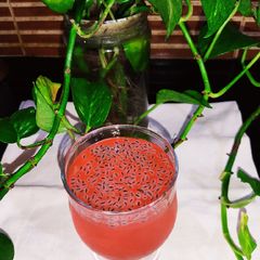 A picture of Chia Seeds in Red Drink.