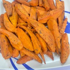A picture of Roasted spiced orange sweet potatoes 🍠.