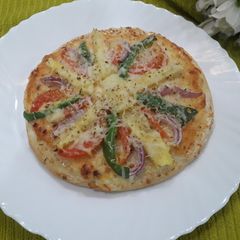 A picture of Pineapple mayonnaise cheese pizza.