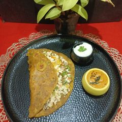 A picture of Protein Rich Sprout Paratha Stuffed With Paneer Mixture.