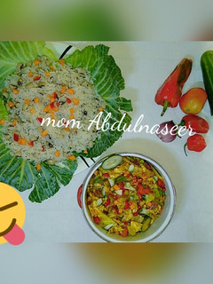 A picture of Rice n beans with cabbage sauce.