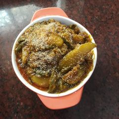 A picture of Mix veg curry with whole poppy seeds.