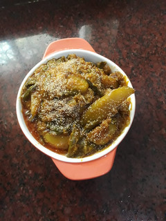 A picture of Mix veg curry with whole poppy seeds.
