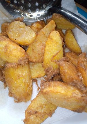 A picture of Fried potatoes in egg.
