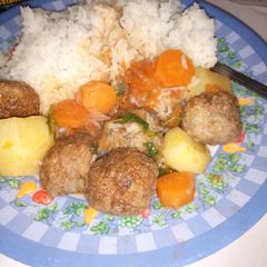A picture of White rice and meat balls.